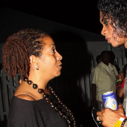 Publication: Something Extra/Social
Photo by Noel Thompson

Yolande Rattray-Wright, managing director of The Wright Agency in Kingston gives some advice to Kwan Brooks, Jamaican Michael Jackson, of Savanna-la-Mar, Westmoreland, after his brief performance on stage, at Reggae Sumfest International NIght last Friday (July 24, 2009) in Catherine Hall, Montego Bay.