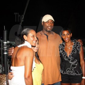 Publication: Something Extra/Social
Photo by Noel Thompson

Boxing champion Lenox Lewis, is flanked by Mareka Saint-Albin, Raquel Dadlani and Isiaa Madden-Brownie,  at Reggae Sumfest International NIght last Friday (July 24, 2009) in Catherine Hall, Montego Bay.