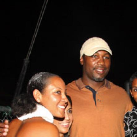 Publication: Something Extra/Social
Photo by Noel Thompson

Boxing champion Lenox Lewis, is flanked by Mareka Saint-Albin, Raquel Dadlani and Isiaa Madden-Brownie,  at Reggae Sumfest International NIght last Friday (July 24, 2009) in Catherine Hall, Montego Bay.
