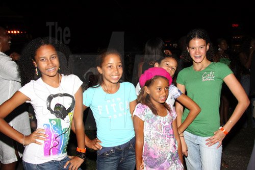 Publication: Daily Star
Photo by Noel Thompson

These sisters and cousins were among the patrons at Reggae Sumfest International Night last Friday (July 24, 2009) in Catherine Hall, Montego Bay. From left are Mia Virture, Blanca Peterkin, Paige Peterkin, Zara Harding and Tori Harding, of Jamaica and New York, respectively.