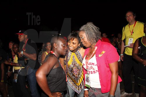 Publication: Something Extra/Social
Photo by Noel Thompson

These women find time to catch up on some topical issue while attending Reggae Sumfest International NIght last Friday (July 24, 2009) in Catherine Hall, Montego Bay.  From left are Coleen Douglas, communications director with the Jamaica National Heritage Trust; Audrie Williams-Odiase and Claudette Powell (right), entertainment editor at FAME FM.