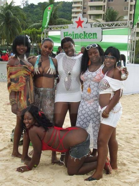 Contributed                                                                                                                                                                   A group of females pose for a shot in front the Heineken bar