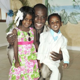 Mark Titus 


Jah Cure's Brother Micheal McBean with his daughter Micheala and son Micha.