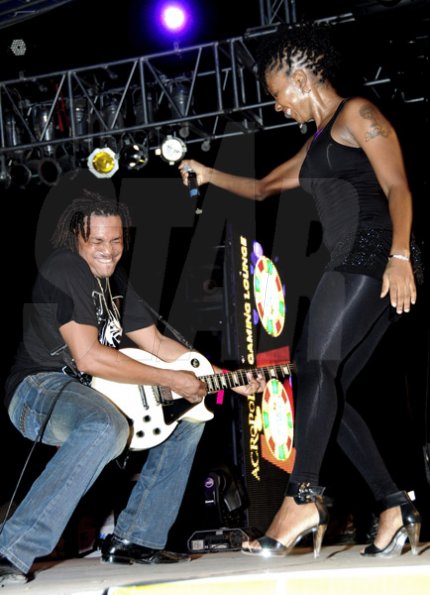 Winston Sill / Freelance Photographer
Fayon Lyons and a guitarist get into the music during Bacchanal Jamaica J'ouvert and Road March at Mas Camp Village, Oxford Road on Friday night.














 April 29, 2011.