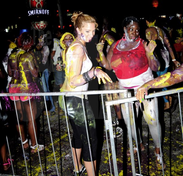 Winston Sill / Freelance Photographer
Paint always seems to make it easier to have fun at a Soca party, as these ladies prove during Bacchanal Jamaica J'ouvert and Road March at Mas Camp Village, Oxford Road on Friday night.





 April 29, 2011.