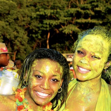 Winston Sill / Freelance Photographer
                                                                                    They certainly enjoyed playing in the paint at Bacchanal Jamaica's Beach J'ouvert at James Bond Beach, Oracabessa, St Mary on Saturday, April 23, 2011.