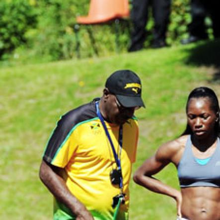 Ricardo Makyn/Staff Photographer
Caoch Burt Cameron speaks with Female Team Captain
Novlene Williams -Mills