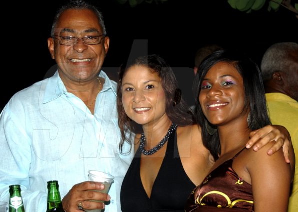 Winston Sill / Freelance Photographer
Dr Michael Banbury should be smiling since he's in the company of Roxanne Lidstrom (centre) and Tanisha Rainford at the Jamdammers Party, held at the American International School, Olivier Road on Saturday night June 20, 2009.