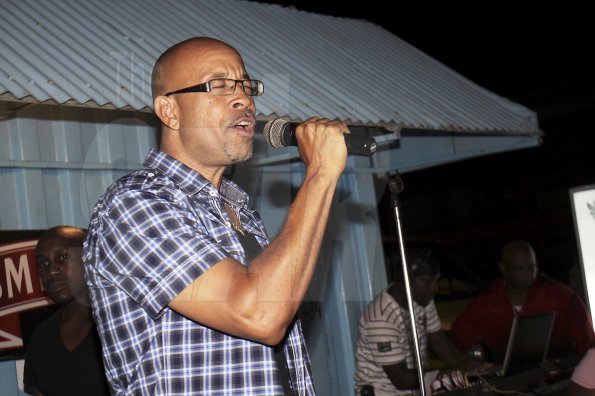 Anthony Minott/Freelance Photographer
SPORTS Max's Lance Whittaker, a veteran Sports Journalist sings during Smirnoff New Star Karaoke at Ken's Wildflower Sports Bar and Lounge, Bayside, Portmore, St Catherine on Monday, September 17, 2012.