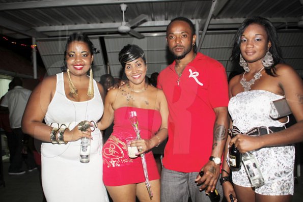 Anthony Minott/Freelance Photographer
From left, Sasha Lawrence, newly engaged Pamella McKenzie and Sean Picart, and Jodi Starlett during Ken's Wildflower Valentine's Night party atop the roof of Ken's Wildflower Restaurant and Lounge, Port Henderson Road, Portmore Plaza, Tuesday, February 14, 2012.