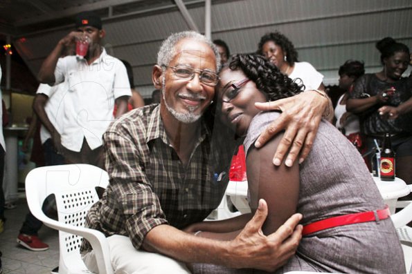 Anthony Minott/Freelance Photographer
Lover's time: a couple embrace during Ken's Wildflower Valentine's Night party atop the roof of Ken's Wildflower Restaurant and Lounge, Port Henderson Road, Portmore Plaza, Tuesday, February 14, 2012.