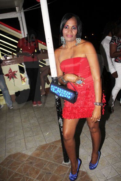 Anthony Minott/Freelance Photographer
This beautiful lady in red strikes a pose during Ken's Wildflower Valentine's Night party atop the roof of Ken's Wildflower Restaurant and Lounge, Port Henderson Road, Portmore Plaza, Tuesday, February 14, 2012.