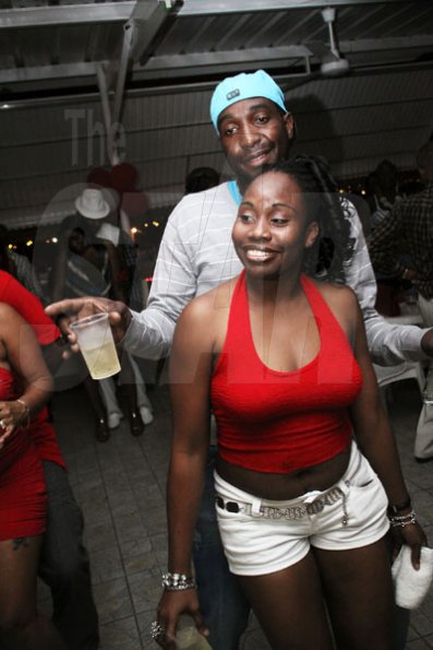 Anthony Minott/Freelance Photographer
a couple enjoying the vibes during Ken's Wildflower Valentine's Night party atop the roof of Ken's Wildflower Restaurant and Lounge, Port Henderson Road, Portmore Plaza, Tuesday, February 14, 2012.
