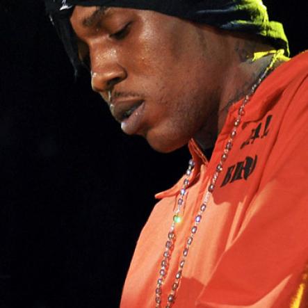 File
Donned in his 'jail bird' uniform, a handcuffed Vybz Kartel was escorted on stage at Dancehall Night Reggae Sumfest 2010 by a supposed hired police officer.