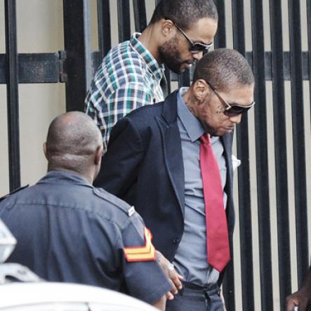 Jermaine Barnaby/Photographer

Vybz Kartel and Shawn Storm as they head out of the Home Circuit Court yesterday.