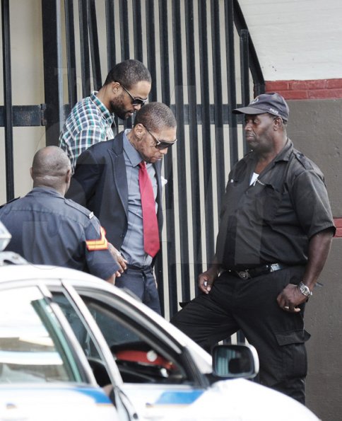 Jermaine Barnaby/Photographer

Vybz Kartel and Shawn Storm as they head out of the Home Circuit Court yesterday.