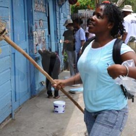 Ricardo Makyn/Staff Photographer.
This  Young Lady is ready with Broom in Hand  in Riversdale on Labour Day in St Catherine on Monday 25.5.2009.