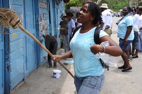 Ricardo Makyn/Staff Photographer.
This  Young Lady is ready with Broom in Hand  in Riversdale on Labour Day in St Catherine on Monday 25.5.2009.