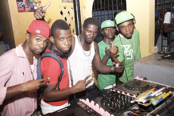 Anthony Minott/Freelance Photographer
Selectors from left, Bling, KC, Harry Hype, DJ Arch, and DJ Marlon, gave the party-hungry patrons what they wanted during Link Up Fridays, Shortwood Road, Grants Pen, in St Andrew on Saturday night, February 3, 2012.