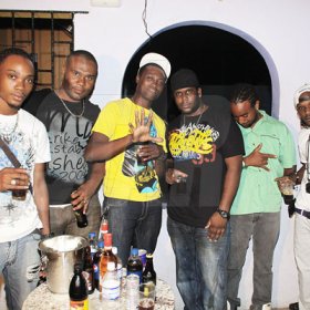 Anthony Minott/Freelance Photographer
Promoter Cass (3rd right), and the G5 Entertainment crew pose for a photo during Link Up Fridayz, 20 Shortwood Road, Grants Pen, St Andrew on Friday, March 2, 2012
