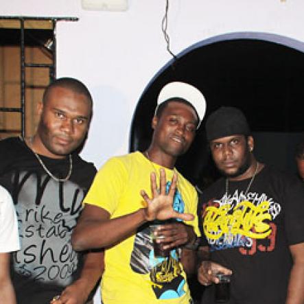 Anthony Minott/Freelance Photographer
Promoter Cass (3rd right), and the G5 Entertainment crew pose for a photo during Link Up Fridayz, 20 Shortwood Road, Grants Pen, St Andrew on Friday, March 2, 2012