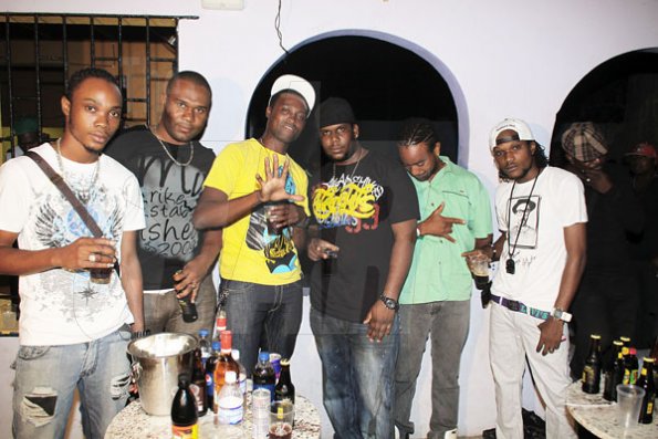 Anthony Minott/Freelance Photographer
Promoter Cass (3rd right), and the G5 Entertainment crew pose for a photo during Link Up Fridayz, 20 Shortwood Road, Grants Pen, St Andrew on Friday, March 2, 2012