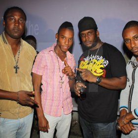 Anthony Minott/Freelance Photographer 
Promoter Cass (2nd right), pose alongside, DJ Khyda and friends  during Link Up Fridayz, 20 Shortwood Road, Grants Pen, St Andrew on Friday, March 2, 2012