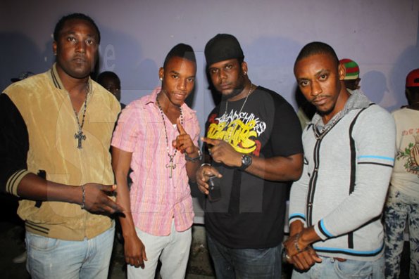 Anthony Minott/Freelance Photographer 
Promoter Cass (2nd right), pose alongside, DJ Khyda and friends  during Link Up Fridayz, 20 Shortwood Road, Grants Pen, St Andrew on Friday, March 2, 2012