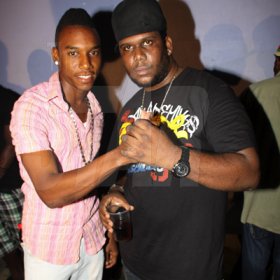 Anthony Minott/Freelance Photographer
DJ Khyda  (left), showing his respect for Promoter Cass, of G5 Entertainment during Link Up Fridayz, 20 Shortwood Road, Grants Pen, St Andrew on Friday, March 2, 2012