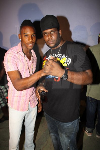 Anthony Minott/Freelance Photographer
DJ Khyda  (left), showing his respect for Promoter Cass, of G5 Entertainment during Link Up Fridayz, 20 Shortwood Road, Grants Pen, St Andrew on Friday, March 2, 2012