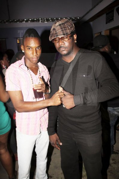 Anthony Minott/Freelance Photographer
DJ Khyda and singer Devonte take a photo opt during Link Up Fridayz, 20 Shortwood Road, Grants Pen, St Andrew on Friday, March 2, 2012