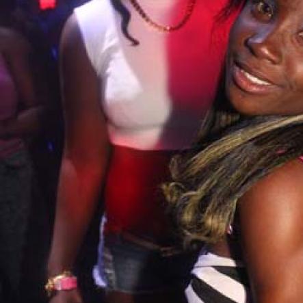 Anthony Minott/Freelance Photographer
she poses delightfully for the camera during a Magnum All Stars Million Dollar Face-off at Famous Night Club in Portmore last Thursday, December 5, 2013.