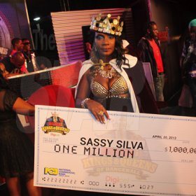 Anthony Minott/Freelance Photographer 
Sassy Silver pose with her winning cheque after being crowned the 2013, Magnum Queen of Dancehall during the Magnum Kings and Queens of Dancehall final live show at D'Entrance, Constant Spring Road, St Andrew on Saturday night.
