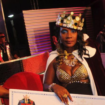 Anthony Minott/Freelance Photographer 
Sassy Silver pose with her winning cheque after being crowned the 2013, Magnum Queen of Dancehall during the Magnum Kings and Queens of Dancehall final live show at D'Entrance, Constant Spring Road, St Andrew on Saturday night.