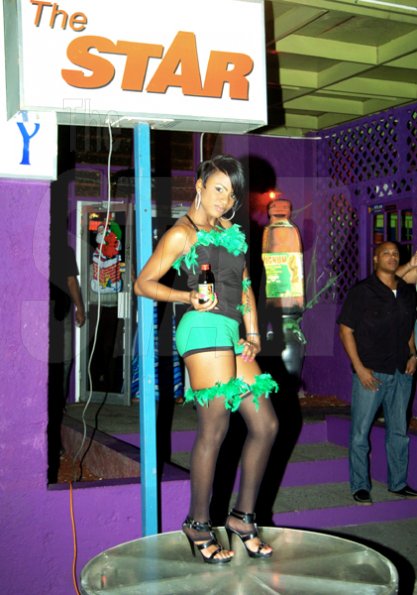 Winston Sill / Freelance Photographer
                                                                                      One of the Magnum Girls gives the 'Star' look during the launch.                                                                                                                                                                                                                                                                                                                                                             of Magnum Kings and Queens of Dancehall, held at Indies Pub, Holborn Road, New Kingston on Tuesday night November 24, 2009.