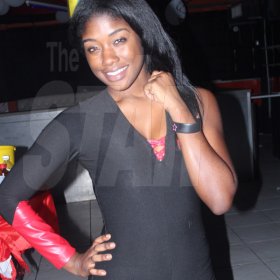 Anthony MInott/Freelance Photographer
Scenes during a Magnum Portmore Dancehall Awards function at Club NTyce, Naggo Head, Portmore, St Catherine last Saturday.  Here a Magnum girl flashes a smile