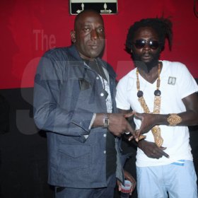 Anthony MInott/Freelance Photographer
Dave "Tallman" Scott (left), the founder of the Magnum Portmore Dancehall Awards hang out with Jah Bouks, who one "song of the year" for the tune Angola during a Magnum Portmore Dancehall Awards function at Club NTyce, Naggo Head, Portmore, St Catherine last Saturday.