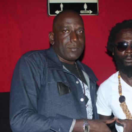 Anthony MInott/Freelance Photographer
Dave "Tallman" Scott (left), the founder of the Magnum Portmore Dancehall Awards hang out with Jah Bouks, who one "song of the year" for the tune Angola during a Magnum Portmore Dancehall Awards function at Club NTyce, Naggo Head, Portmore, St Catherine last Saturday.