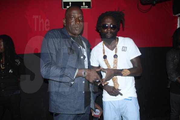 Anthony MInott/Freelance Photographer
Dave "Tallman" Scott (left), the founder of the Magnum Portmore Dancehall Awards hang out with Jah Bouks, who one "song of the year" for the tune Angola during a Magnum Portmore Dancehall Awards function at Club NTyce, Naggo Head, Portmore, St Catherine last Saturday.