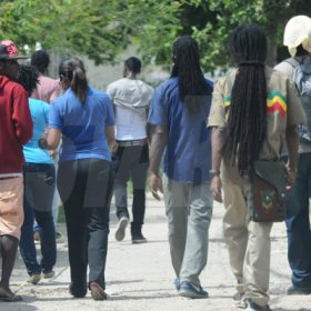 Jermaine Barnaby/Freelance Photographer
Members of the Peace Management Initiative (PMI) among other community members in the March Pen road on Monday October 10, 2016.