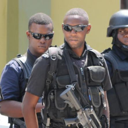 Jermaine Barnaby/Freelance Photographer
Police and soldiers in the March Pen road shooting area on Monday October 10, 2016.
