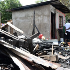 Jermaine Barnaby/Freelance Photographer
One of the houses that was set ablaze allegedly by the gunmen in March Pen road shooting on Monday October 10, 2016.