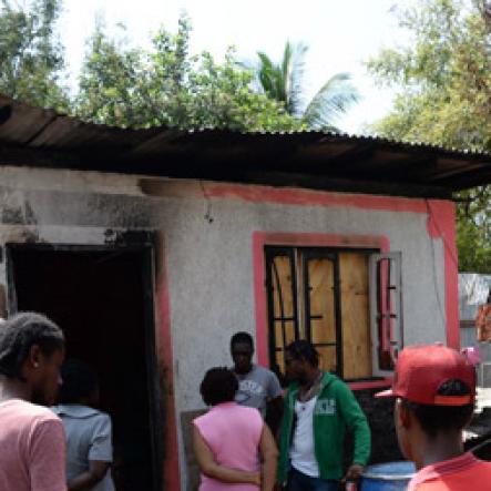 Jermaine Barnaby/Freelance Photographer
Members of the Peace Management Initiative (PMI) at the premises where five persons were reportedly shot and killed in March Pen road on Monday October 10, 2016.