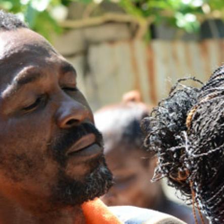 Rudolph Brown/Photographer
Jennifer McDonald, Mother and grandmother mourning the death of family after gunmen shoot up seven killing five including three children and set their home ablaze at Africa settlement in March Pen Community in Spanish Town on Sunday, October 9