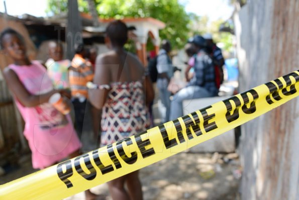 Rudolph Brown/Photographer
Family members mourning the death of family after gunmen shoot up seven killing five including three children and set their home ablaze at Africa settlement in March Pen Community in Spanish Town on Sunday, October 9