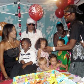 Roxroy McLean Photo

D'Angel (left) and Beenie Man(right), celebrates with their son Marco-Dean (seated) on his third birthday party. Inthe background in Pretty Boy Floyd and other guests.
