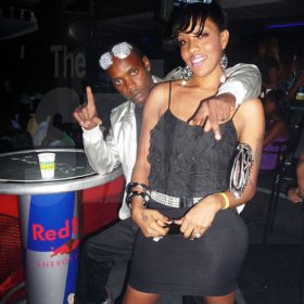Roxroy McLean photo                                                                                                                                                 Dancehall artiste Flexxx and a female companion hang out at the 'Real McKoy' party.