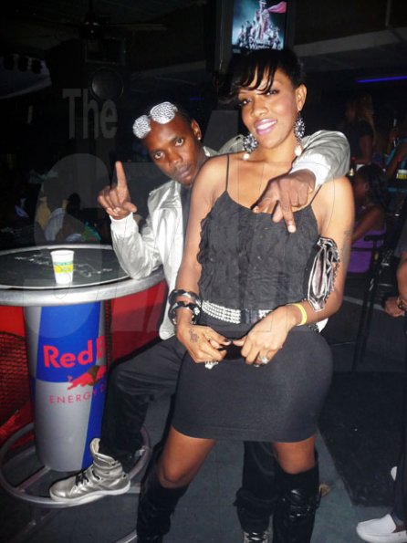 Roxroy McLean photo                                                                                                                                                 Dancehall artiste Flexxx and a female companion hang out at the 'Real McKoy' party.