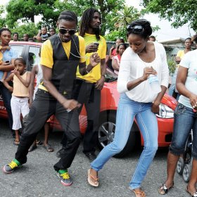 Ian Allen/Photographer
400 metre World Championship winner Melanie Walker and her brother dance up a storm on her arrival on Maxfield Avenue on tuesday.