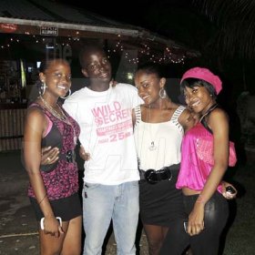 From left: Friends Joannell Smith, Christopher Lake, Shamone Gordon and Melissa Malcolm are determined to have a good time at 'Meltdown' in Montego Bay recently.